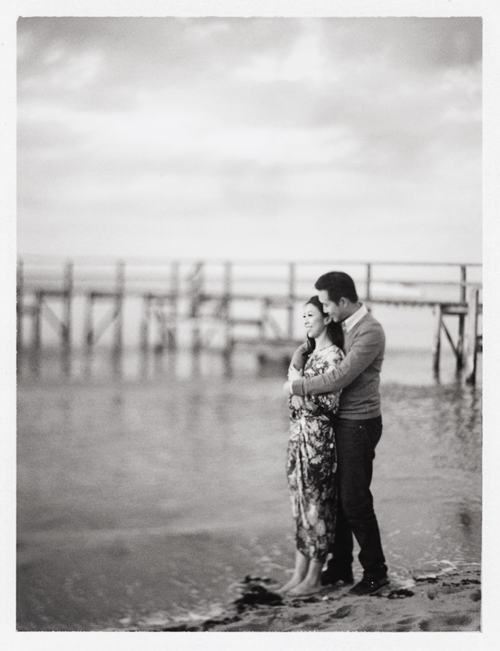 polaroid black and white engagement photography on the beach