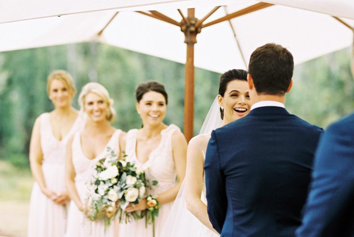 bride laughing during the wedding ceremony