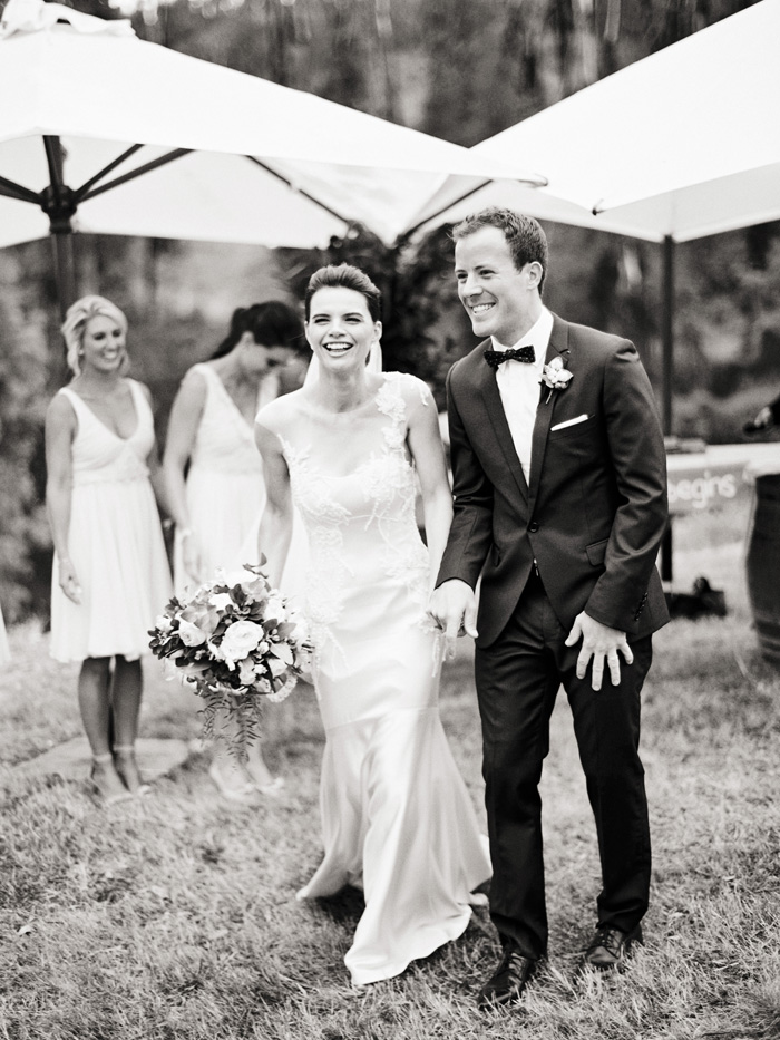 bride and groom walking back down the aisle as husband and wife