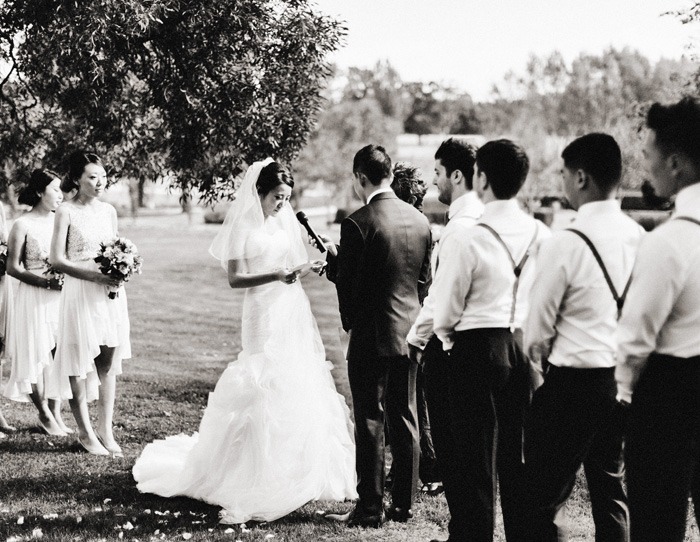 bride reading her vows at wedding ceremony