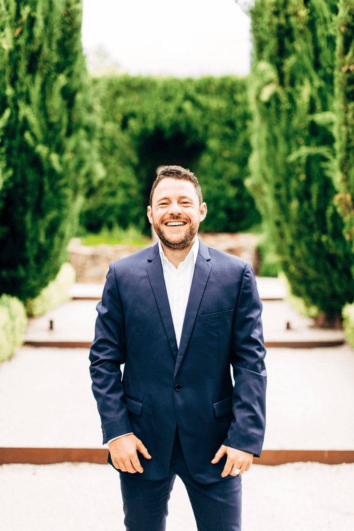 groom on his wedding day having his portrait photographed