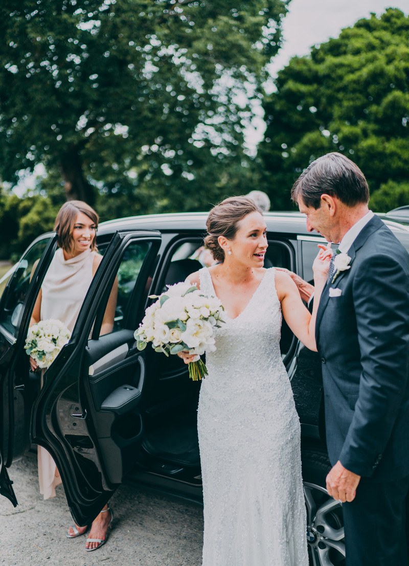 bride arriving at wedding ceremony with dad