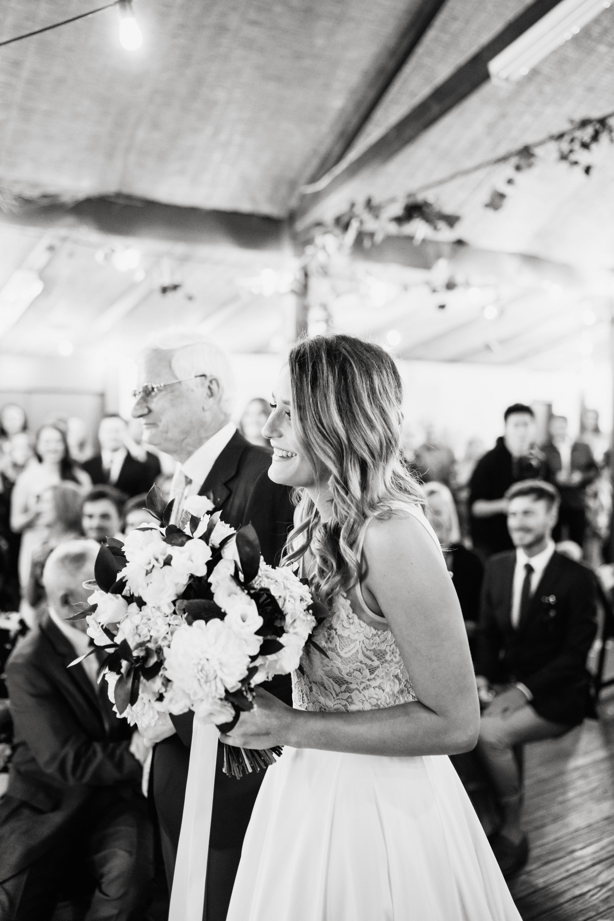 bride and dad walking down the wedding aisle