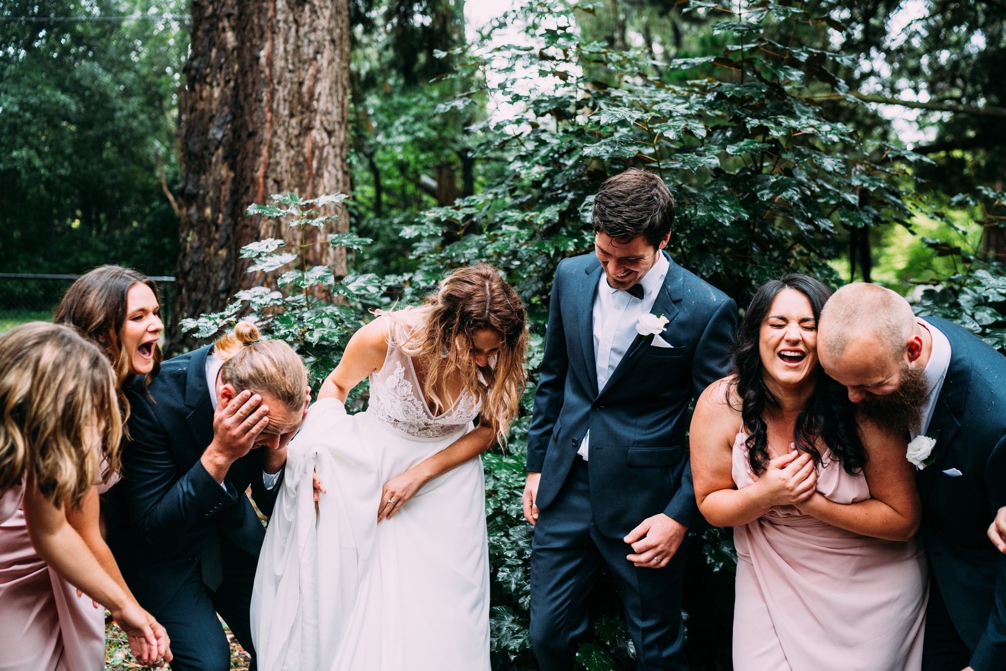 bridal party having so much fun on their wedding day