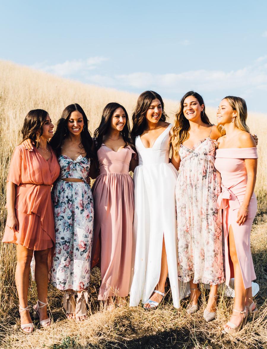 bridesmaids relaxed and candid wedding in the country in long grass