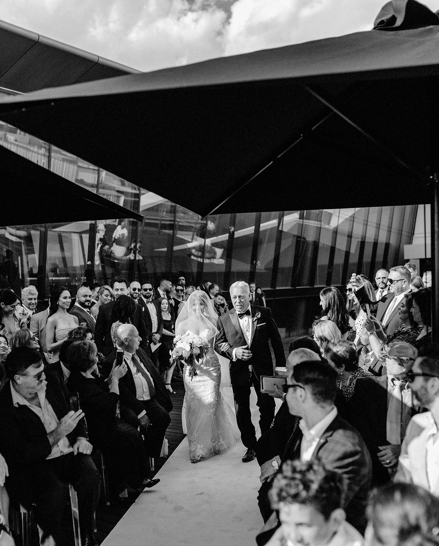 dad and bride walking down aisle